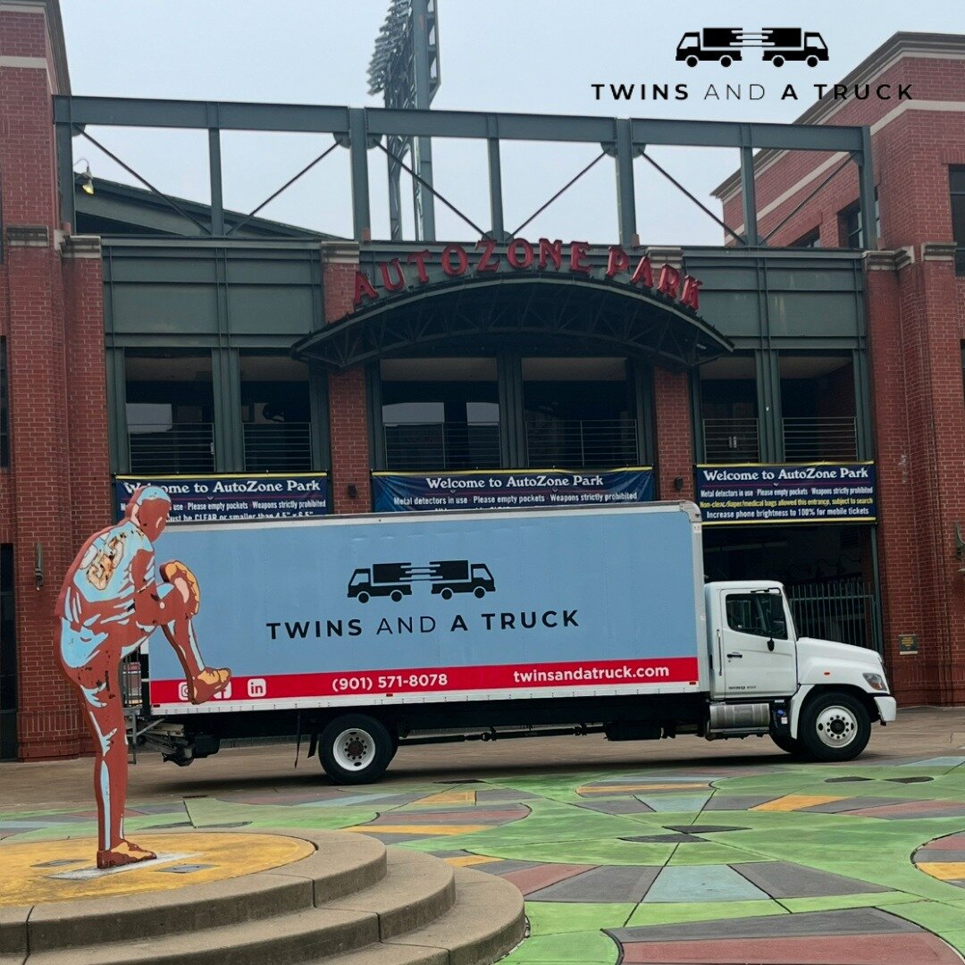 Twins and a Truck moving truck parked in front of AutoZone Park in downtown Memphis